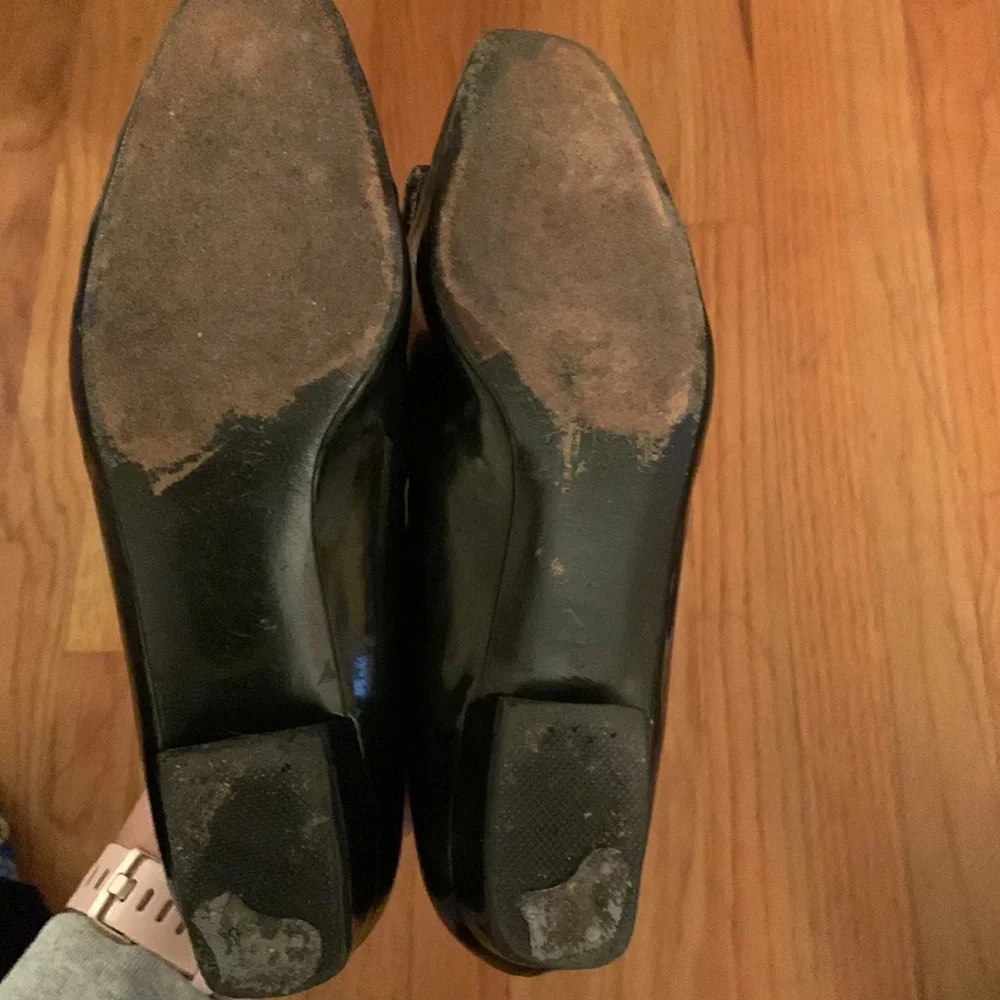 Stuart Weitzman black patent leather loafers with gold plaques and low heel 6